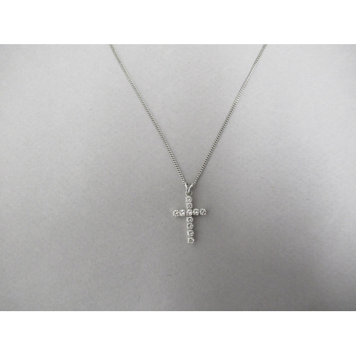 177 - A diamond cross pendant on 18ct white gold chain (hallmarked) set with 11 round brilliant cut diamon... 