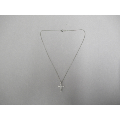 177 - A diamond cross pendant on 18ct white gold chain (hallmarked) set with 11 round brilliant cut diamon... 