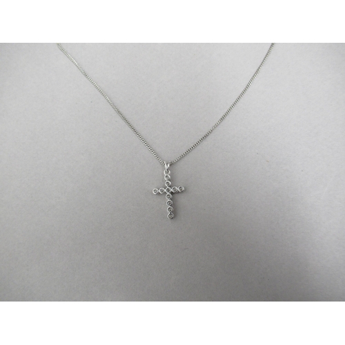 177 - A diamond cross pendant on 18ct white gold chain (hallmarked) set with 11 round brilliant cut diamon... 