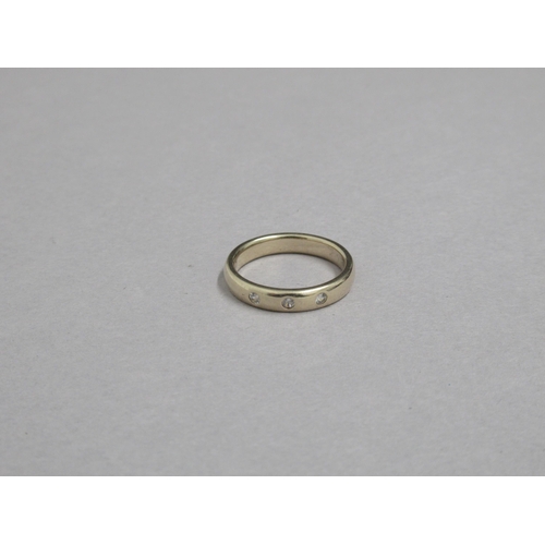 180 - A 9ct yellow gold (hallmarked) band set with three white stones - ring size Q/R - approx weight 5.2 ... 