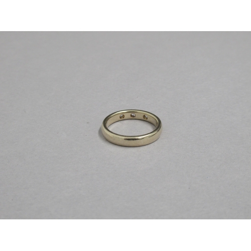 180 - A 9ct yellow gold (hallmarked) band set with three white stones - ring size Q/R - approx weight 5.2 ... 