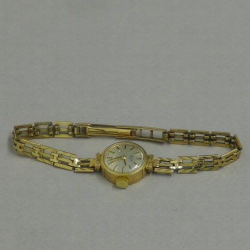 254 - A ladies Rotary watch on a 9ct hallmarked strap - approx weight 12.4 grams