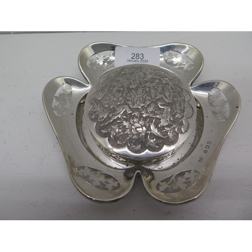 283 - A silver caster, London 1920, approx 13cm and a Middle Eastern silver box and cover, approx 7.5cm, t... 