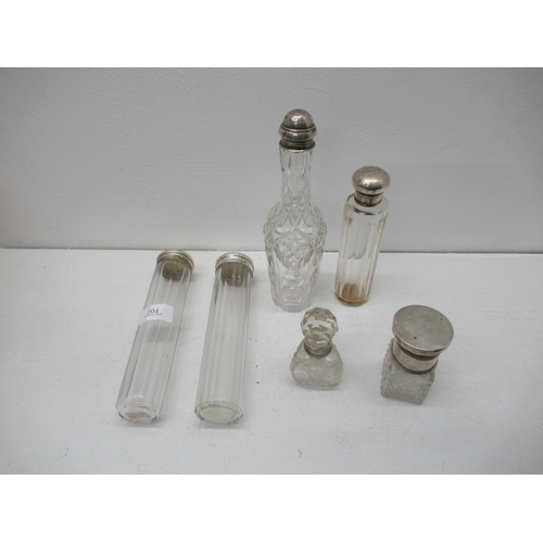 304 - Six silver topped cut glass bottles