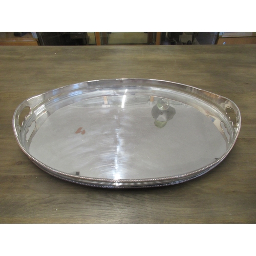 308 - Two Sheffield silver plate trays - larger oval shaped with pierced gallery approx 61cm x 41cm