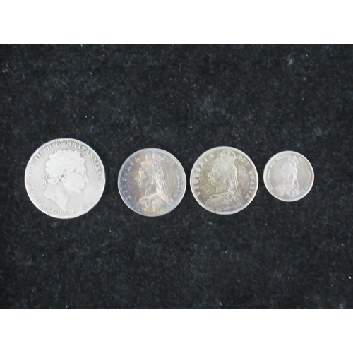 328 - Four 19th century English silver coins - 1819 Crown, 1887 1/2 Crown (VF), 1890 1/2 Crown and 1887 Sh... 