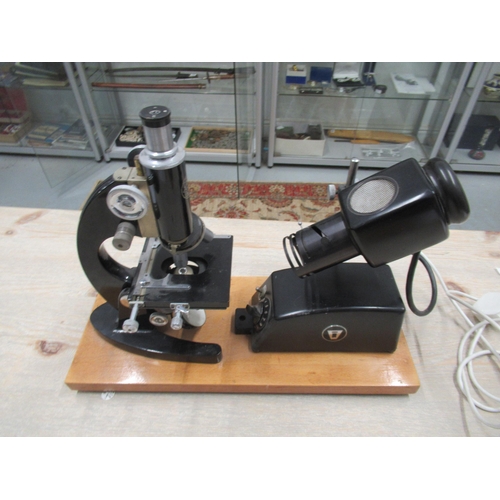 355 - A C.Baker microscope with electric lamp