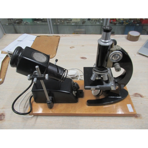 355 - A C.Baker microscope with electric lamp