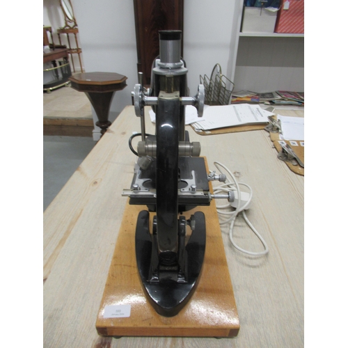 355 - A C.Baker microscope with electric lamp