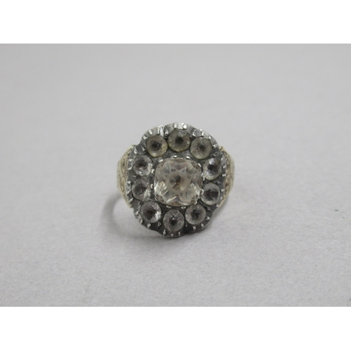 37 - A Georgian white paste cluster ring, yellow and white metal - scroll work to shoulders - ring size P... 