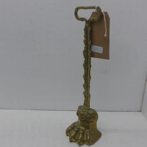 372 - A brass claw door stop - Height 39cm