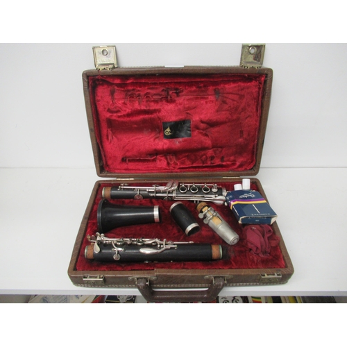 381 - A clarinet in fitted leather case by Boosey & Hawkes complete with accessories