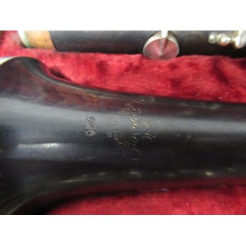 381 - A clarinet in fitted leather case by Boosey & Hawkes complete with accessories