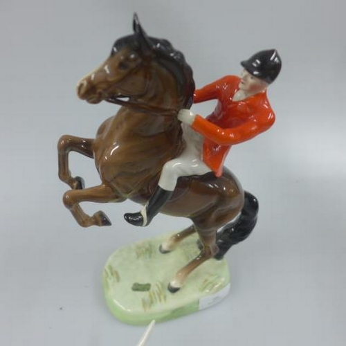 389 - Beswick - mounted fox hunter - 23cm - together with four hounds and fox