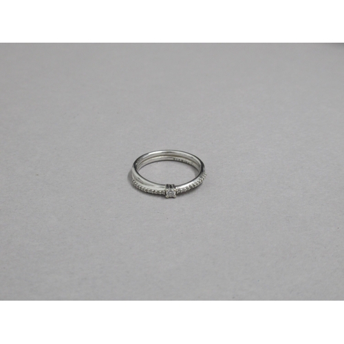 48 - An 18ct white gold hallmarked ring with CZ double crossover band, size P/Q, approx 4.3 grams, with b... 