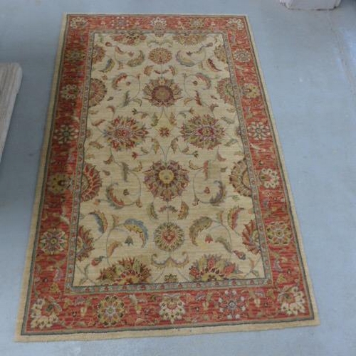 481 - A woven wool rug - 170cm x 106cm