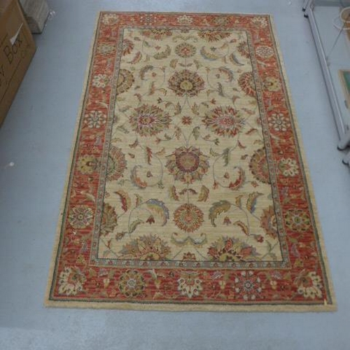 482 - A woven wool rug - 170cm x 106cm