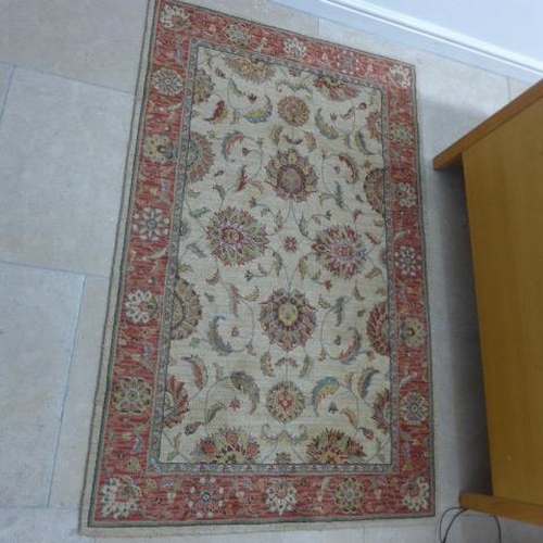 483 - A woven wool rug - 170cm x 106cm