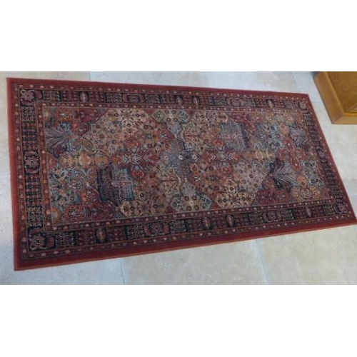 487 - A John Lewis woven rug - 80cm x 160cm