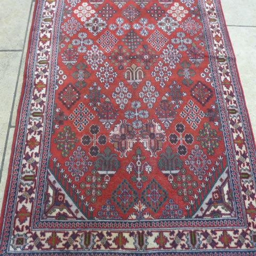 489 - A Meimeh hand knotted woollen rug - 3.98m x 1.05m