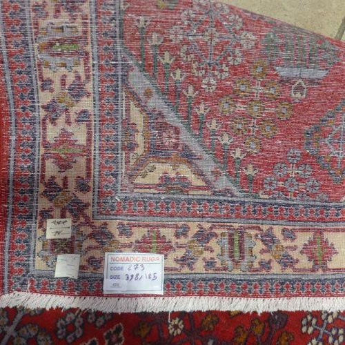 489 - A Meimeh hand knotted woollen rug - 3.98m x 1.05m