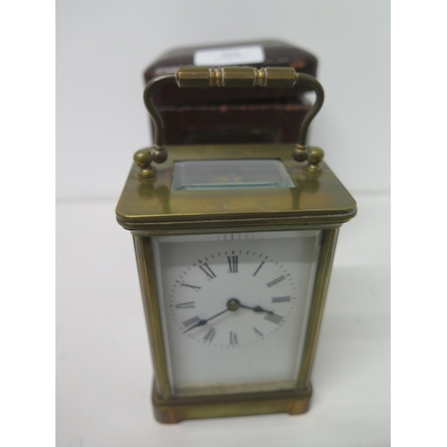 500 - A brass cased four glass carriage clock in leather travelling case - approx 11cm - working in salero... 