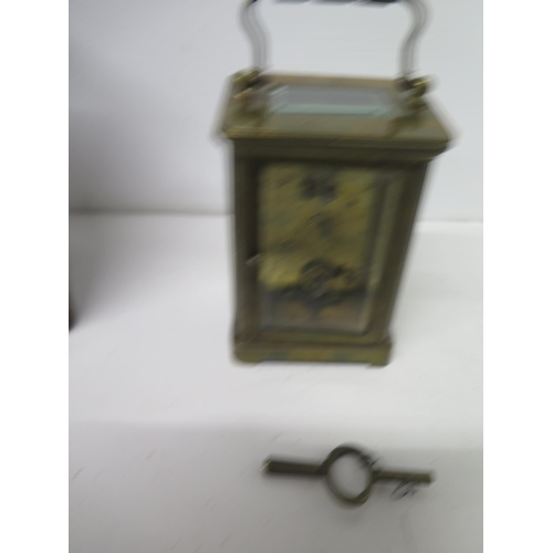 500 - A brass cased four glass carriage clock in leather travelling case - approx 11cm - working in salero... 