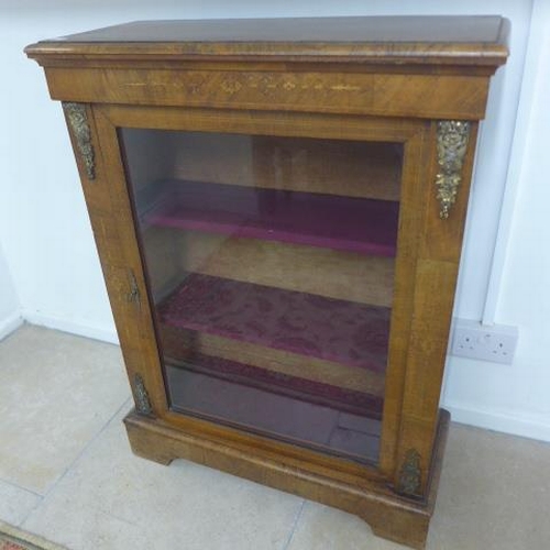 504 - A mid 19th century pier cabinet fitted with a single glazed door enclosing two shelves - 102cm x 76c... 