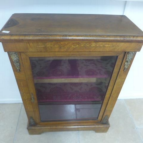 504 - A mid 19th century pier cabinet fitted with a single glazed door enclosing two shelves - 102cm x 76c... 