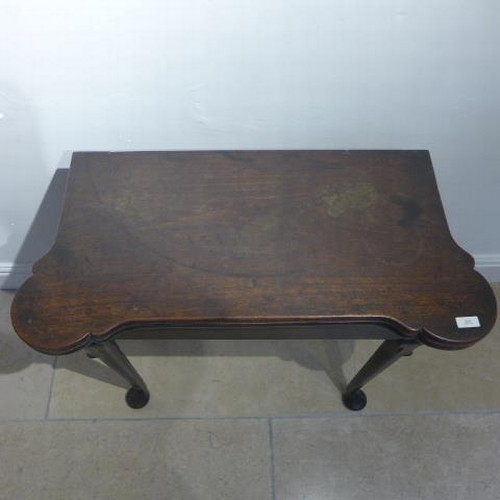 509 - A Georgian mahogany fold over tea table, 78cm wide, with a good patina