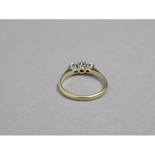 52 - An 18ct yellow gold and platinum hallmarked 3 stone diamond ring, size O, approx 2.9 grams