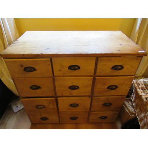 532 - An antique pine 12 drawer merchants chest - Height 82cm x Width 91cm x Depth 50cm