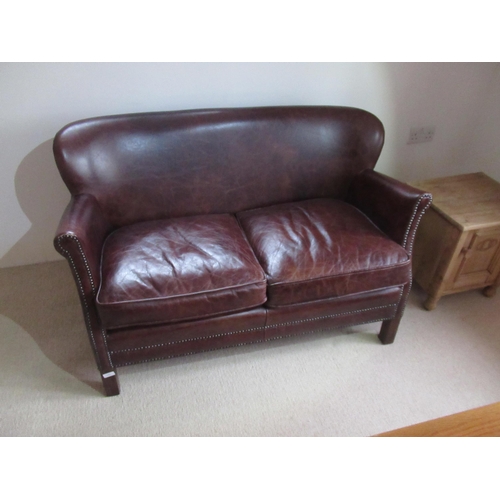 549 - A John Lewis leather small bedroom two seater sofa - Width 117cm