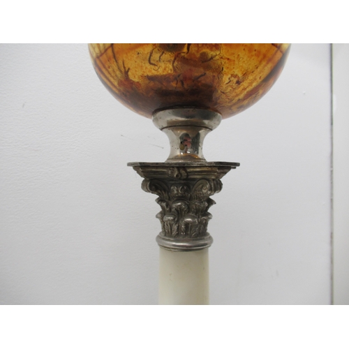 561 - An alabaster and white metal Corinthian paraffin lamp with amber glass, 57cm tall