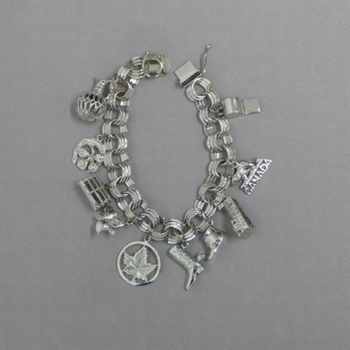 57 - A silver charm bracelet, approx 1.5 troy oz