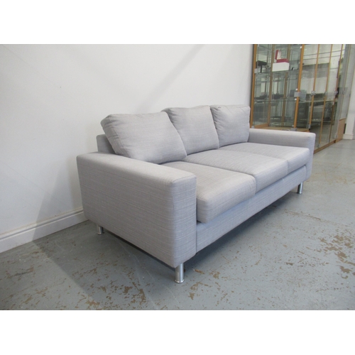 585 - A modern grey cloth three seater sofa - 200cm x 90cm x 90cm