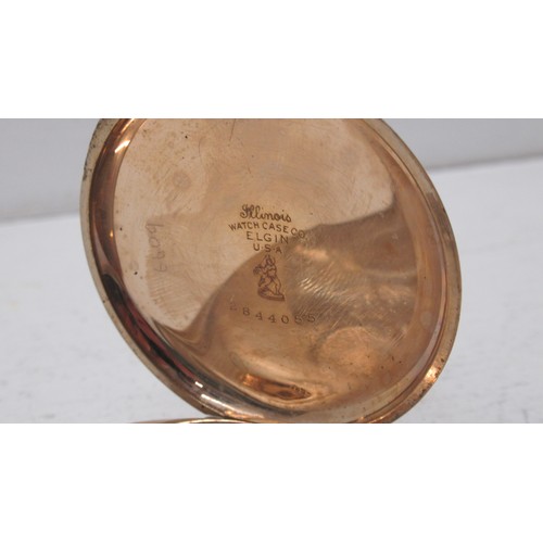 232 - An Elgin gold plated half hunter pocket watch - approx 5cm diameter - working in the saleroom but ne... 