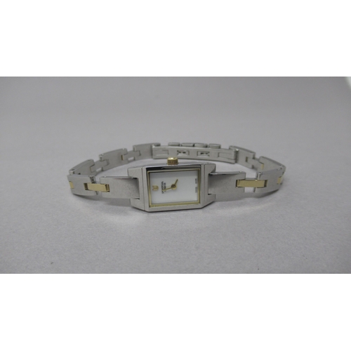 233 - A Universal Geneve ladies bi metal bracelet watch with mother of pearl dial - good overall condition... 