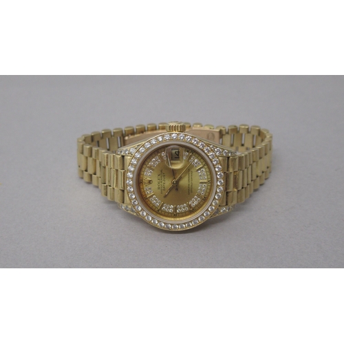 234 - A ladies 18ct yellow gold Rolex Oyster Perpetual Datejust bracelet watch, a champagne dial with diam... 