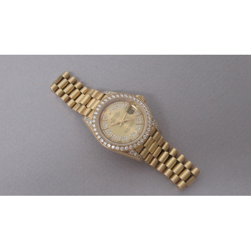 234 - A ladies 18ct yellow gold Rolex Oyster Perpetual Datejust bracelet watch, a champagne dial with diam... 