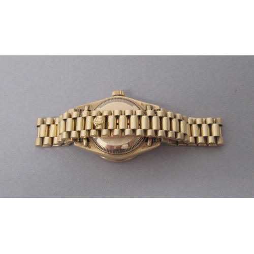 234 - A ladies 18ct yellow gold Rolex Oyster Perpetual Datejust bracelet watch, a champagne dial with diam... 