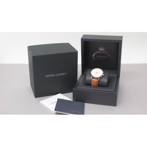 255 - A Georg Jensen quartz chronograph wristwatch, champagne dial, with box and papers, original tan leat... 