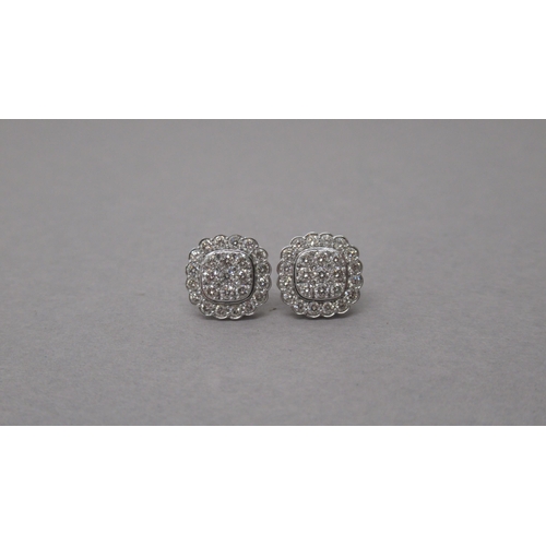 81 - A pair of 14ct white gold rounded square diamond cluster studs, boxed - round brilliant cut diamonds... 