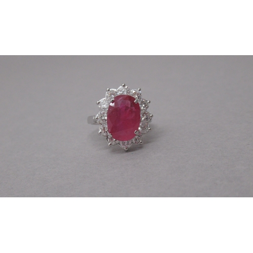 84 - A certificated 18ct white gold large oval ruby and diamond cluster ring - Ruby 3.71ct - round brilli... 