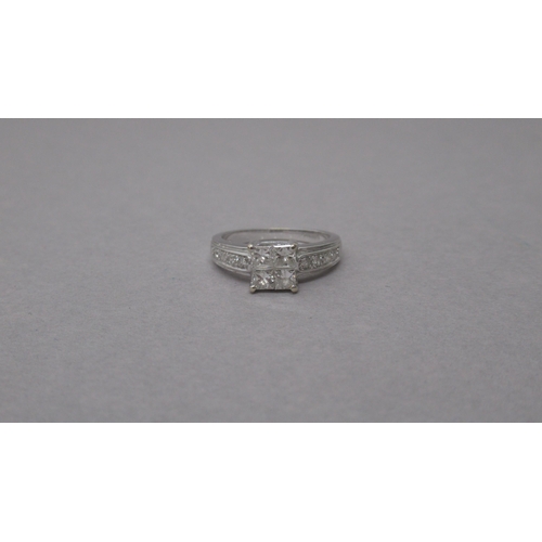 89 - An 18ct white gold and diamond ring - Four central square cut diamonds each approx 0.15-0.2ct - shou... 