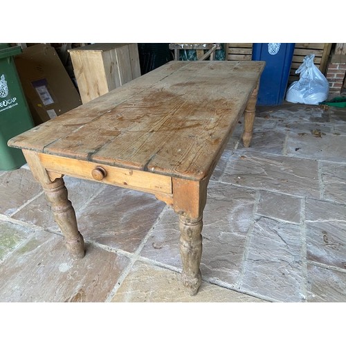 581 - A Pine kitchen table 184 cm by 86 cm in sound condition