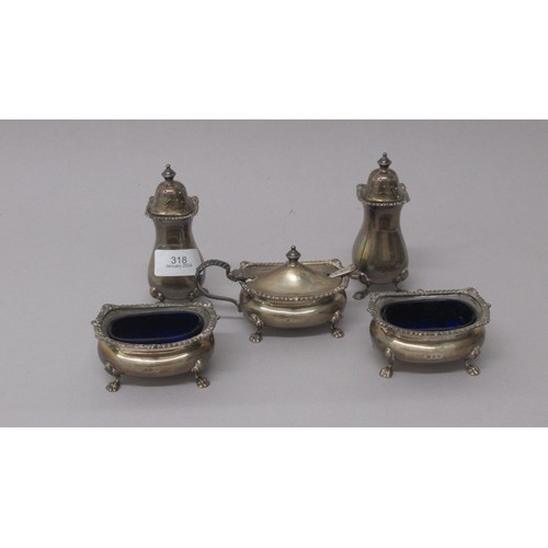 318 - A five piece condiment set - Gold & Silversmiths Co. London 1936 - Two salts, two pepper shakers and... 