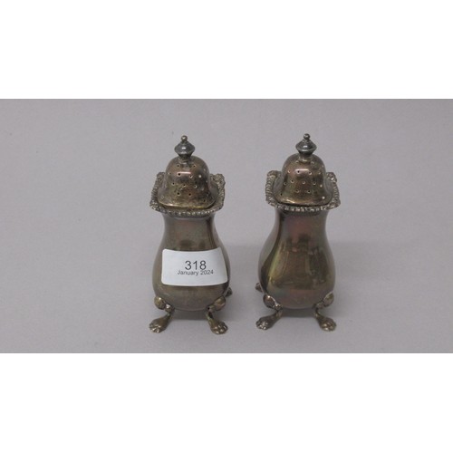 318 - A five piece condiment set - Gold & Silversmiths Co. London 1936 - Two salts, two pepper shakers and... 