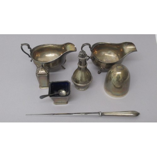 320 - Silver items inc: A pair of sauce boats, Chester 1928, salt with spoon, pepper shaker, sugar shaker ... 