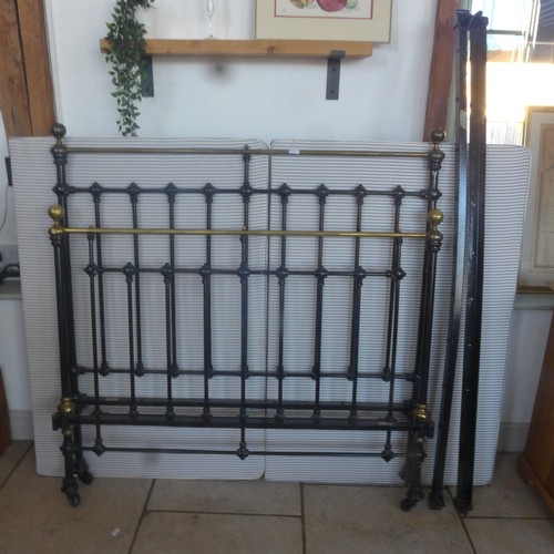 529A - A 19th century brass and iron double bed - 4ft 6in wide with a base and irons - in good condition